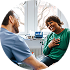 Man and woman sitting down and looking at a laptop
